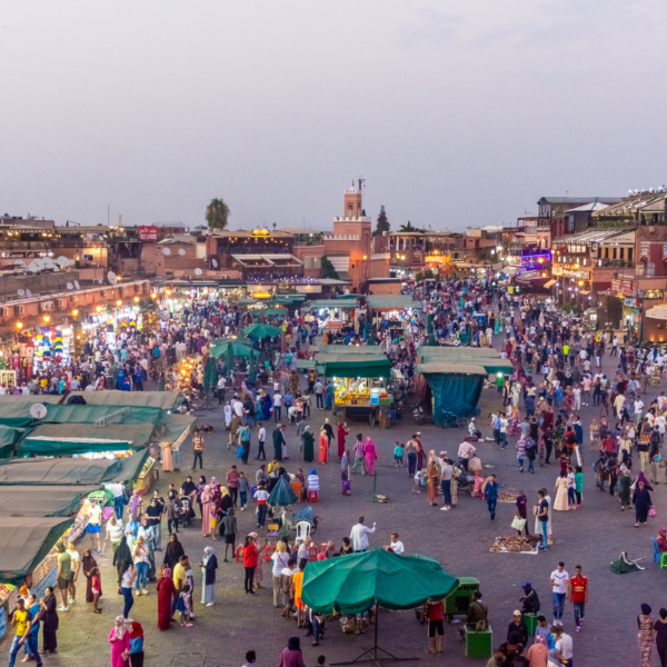 Luxurious private tour car driving through the streets of Marrakech.
